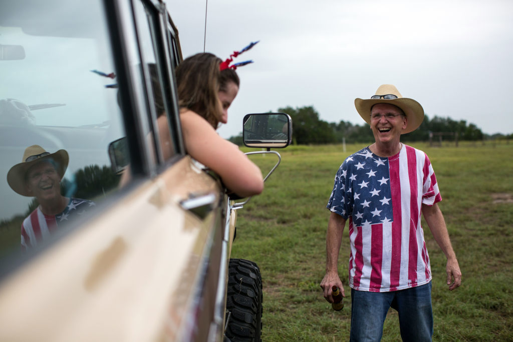 ROUND TOP, TX - JULY 04: Hannah Starke and Landis Newbanks share a laugh after the 168th annual Round Top Fourth of July Parade on July 4, 2018 in Round Top, Texas. The Round Top community's Fourth of July celebration started in 1851 and is known as the longest running Fourth of July celebration west of the Mississippi. (Photo by Tamir Kalifa/Getty Images)