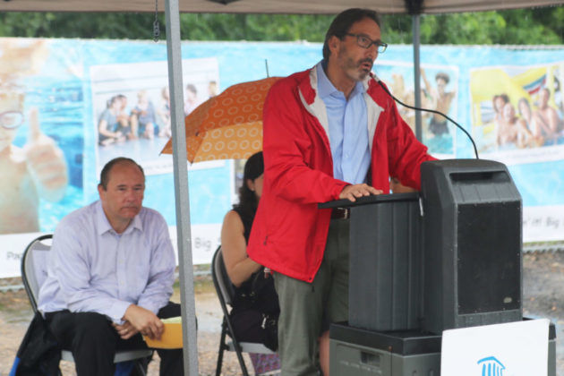 Former County Board member Jay Fisette speaks at the Long Bridge Park aquatics center groundbreaking. (ARLNow.com)