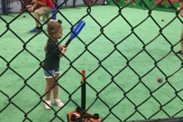 On one end of the hall were batting cages, where fans were able to take some hacks from off a pitching machine. On another, there were cages synced up to measure bat speed. There was even a virtual reality home run derby. (WTOP/John Domen)