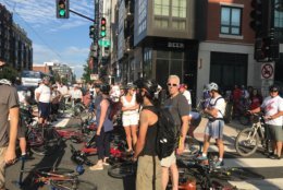 During the short memorial and protest, car horns honked and a few drivers cursed as they saw the crowd of bicyclists causing the momentary slow down. (WTOP/Dick Uliano)