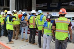 Workers top off the construction at Lumen at Tysons. (Coutesy Hoar Construction)