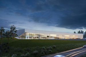 This rendering shows the exterior view of the aquatics center at night. (Courtesy ARLNow/Chris Teale)
