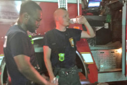 Firefighters rehydrate for their next call while still on the scene of a fire on M Street Northwest near downtown D.C. (Courtesy D.C. Fire and EMS via Twitter)