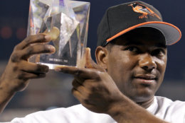 American League All-Star Miguel Tejada of the Baltimore Orioles holds the MVP trophy after the American League defeated the National League 7-5 in the 2005 MLB All-Star Game at Comerica Park in Detroit, Tuesday, July 12, 2005.  (AP Photo/Paul Sancya)
