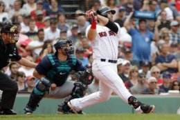 Boston Red Sox's Mitch Moreland watches a home run against the Seattle Mariners during the second inning of a baseball game Sunday, June 24, 2018 in Boston. (AP Photo/Winslow Townson)