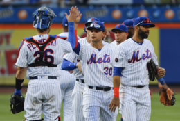 New York Mets' Michael Conforto (30) celebrates with teammates after the Mets beat the Washington Nationals 7-4 in a baseball game, Saturday, July 14, 2018, in New York. (AP Photo/Julie Jacobson)