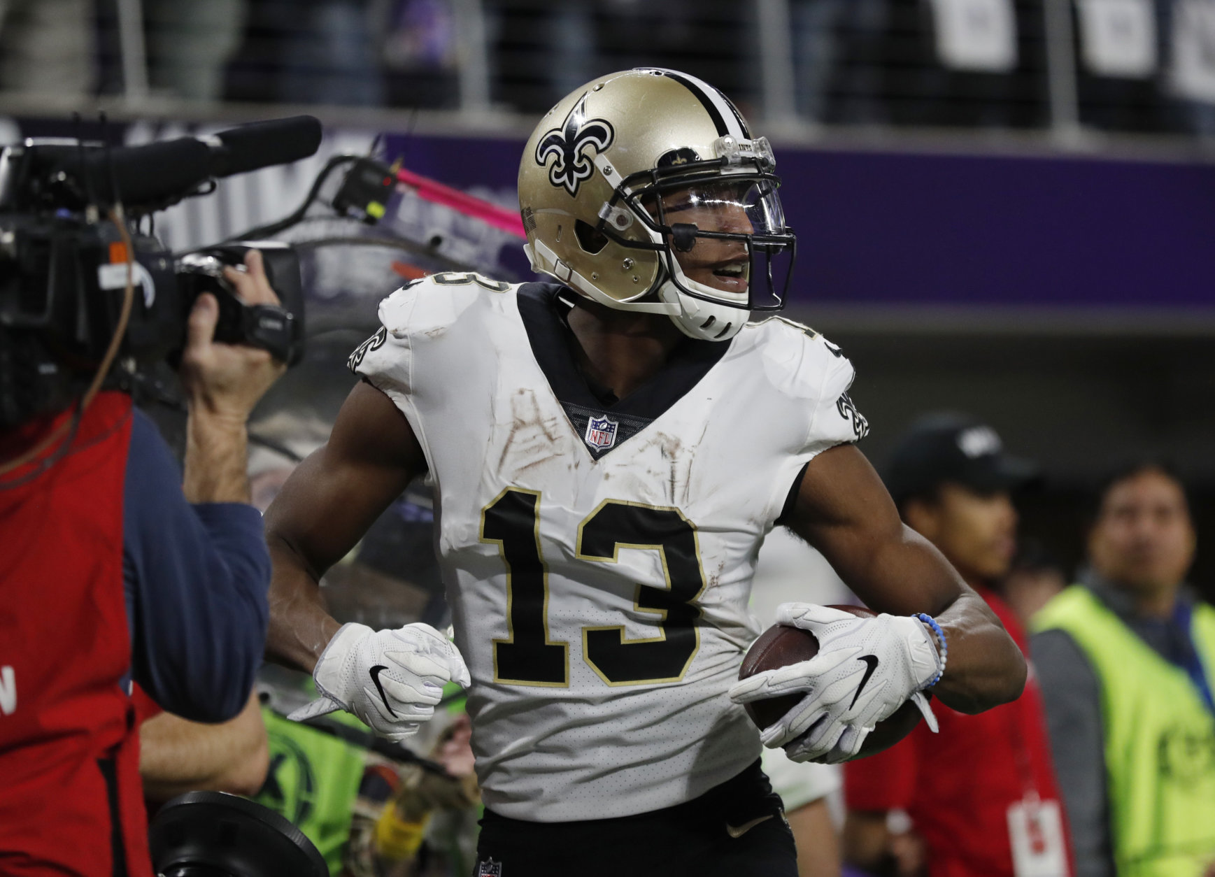 New Orleans Saints wide receiver Michael Thomas (13) celebrates his touchdown catch during the second half of an NFL divisional football playoff game against the Minnesota Vikings in Minneapolis, Sunday, Jan. 14, 2018. (AP Photo/Charlie Neibergall)
