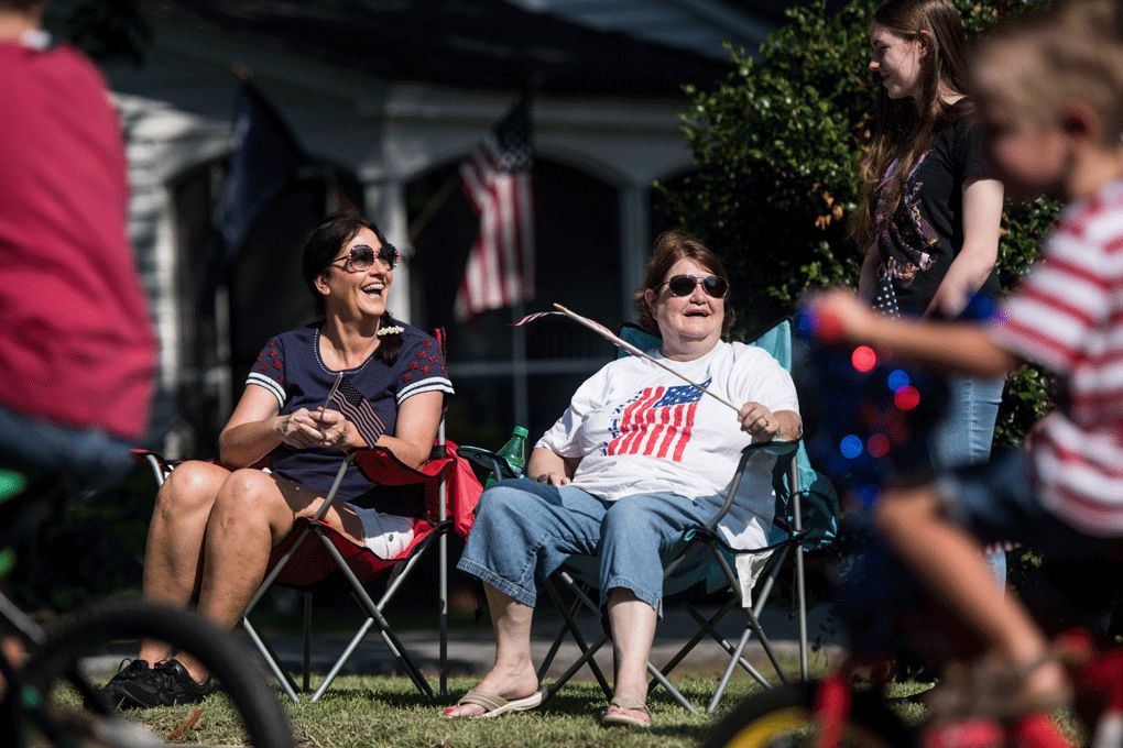 Residents watch the sixteenth annual Harper Street Parade on July 4, 2018 in Newberry, South Carolina. The event, beginning as a small bicycle gathering with less than thirty children, attracted 4,000 people last year. (Photo by Sean Rayford/Getty Images)