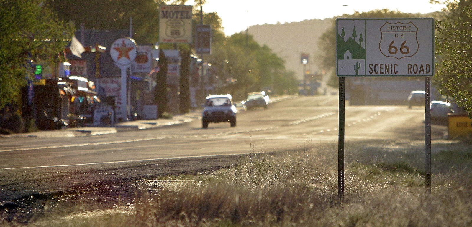 In this Thursday, May 5, 2011 picture, the sun sets in Seligman, Ariz. Angel Delgadillo, 84, was the driving force behind the formation of the Historic Route 66 Association of Arizona, which lobbied the state to dedicate U.S. 66 as "Historic Route 66." Highway signs were erected, the association launched an annual "Fun Run" of classic cars, tourists and media began converging and Seligman was reborn. (AP Photo/Matt York)