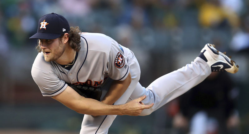 Houston Astros pitcher Gerrit Cole follows through on a delivery to an Oakland Athletics batter during the first inning of a baseball game Wednesday, June 13, 2018, in Oakland, Calif. (AP Photo/Ben Margot)