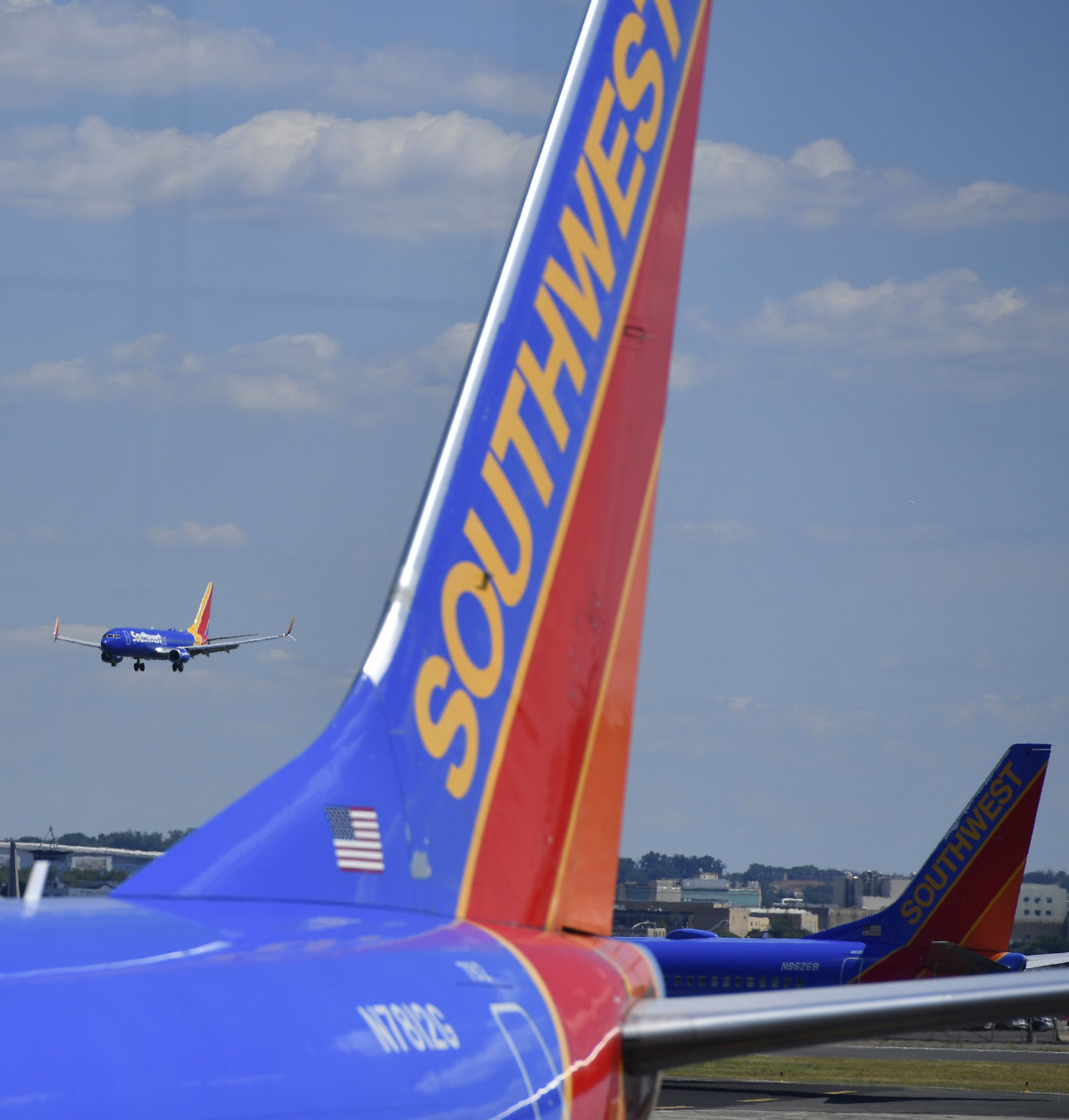 Southwest Airlines aircraft sit at the terminal, Thursday, July 19, 2018, at Ronald Reagan Washington National Airport, in Washington. (AP Photo/Mike Stewart)