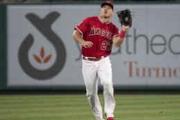 Los Angeles Angels center fielder Mike Trout catches a fly ball during a baseball game in Anaheim, Calif., Wednesday, June 6, 2018. (AP Photo/Kyusung Gong)