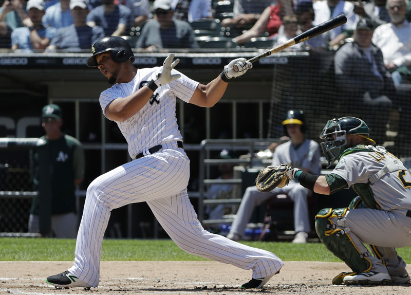Chicago White Sox's Jose Abreu hits a one-run single against the Oakland Athletics during the first inning of a baseball game Saturday, June 23, 2018, in Chicago. (AP Photo/Nam Y. Huh)