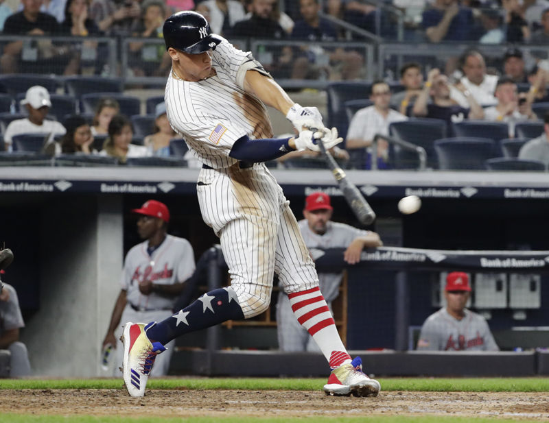 New York Yankees' Aaron Judge hits a single during the sixth inning of the team's baseball game against the Atlanta Braves on Tuesday, July 3, 2018, in New York. (AP Photo/Frank Franklin II)
