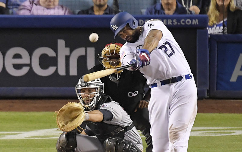 Los Angeles Dodgers' Matt Kemp, right, hits a three-run home run as Pittsburgh Pirates catcher Jacob Stallings, left, watches along with home plate umpire Laz Diaz during the sixth inning of a baseball game, Monday, July 2, 2018, in Los Angeles. (AP Photo/Mark J. Terrill)