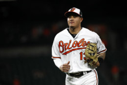 Baltimore Orioles shortstop Manny Machado jogs off the field between innings of a baseball game against the Seattle Mariners, Monday, June 25, 2018, in Baltimore. (AP Photo/Patrick Semansky)