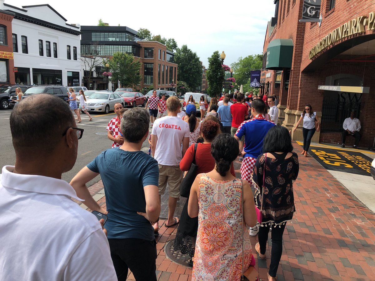 People wait in line for a chance to catch the Croatia Vs. France World Cup final. (WTOP/Keara Dowd)