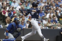Milwaukee Brewers' Christian Yelich hits a double during the third inning of a baseball game against the Kansas City Royals Wednesday, June 27, 2018, in Milwaukee. (AP Photo/Morry Gash)