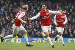 Aresenal's Mikel Arteta celebrates after scoring his sides 4th goal during the English Premier League soccer match between Arsenal and Blackburn at the Emirates Stadium in London, Saturday Feb. 4, 2012. (AP Photo/Kirsty Wigglesworth)
