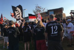Members of supporter group La Barra Brava stand outside D.C. United's new stadium Audi Field on Saturday, July 14, 2018. (WTOP/Liz Anderson)
