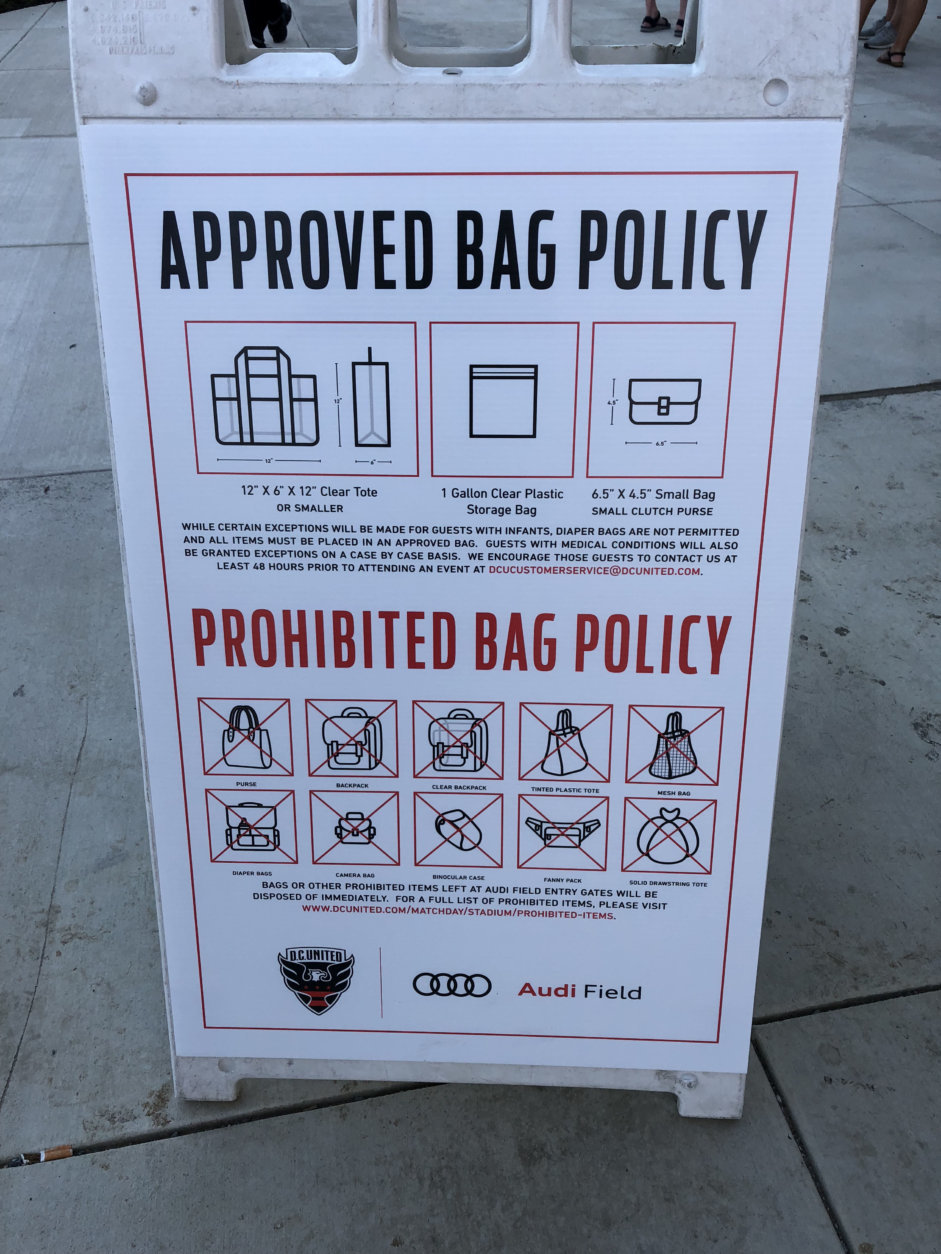 A sign outside Audi Field during a D.C. United Game on Saturday, July 28, 2018, lists the types of bag allowed and prohibited inside the stadium. (WTOP/Mike McMearty)
