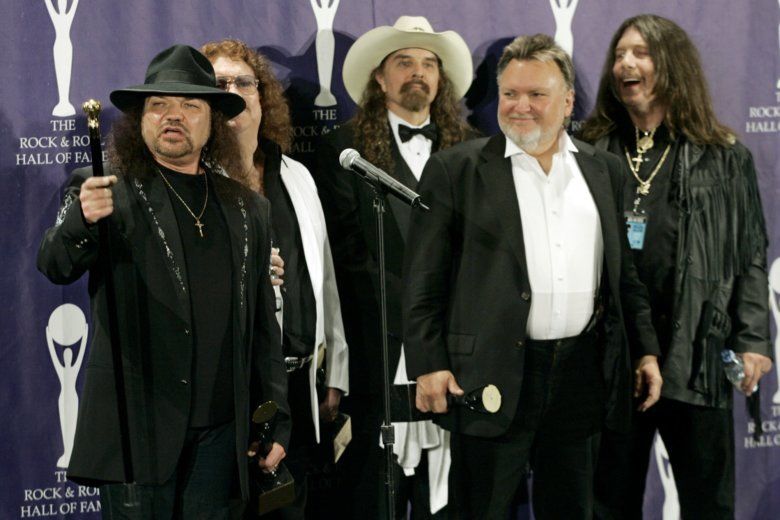 In this March 13, 2006 file photo, members of Lynyrd Skynyrd, from left, Gary Rossington, Billy Powell, Artimus Pyle, Ed King and Bob Burns, appear backstage after being inducted at the annual Rock and Roll Hall of Fame dinner in New York. A family statement said King, who helped write several of their hits including “Sweet Home Alabama,” died from cancer, Wednesday, Aug. 22, 2018, in Nashville, Tenn. He was 68. (AP Photo/Stuart Ramson, File)