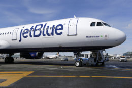 FILE- In this March 16, 2017, file photo, a Jet Blue airplane at John F. Kennedy International Airport in New York. JetBlue Airways Corp. reports earnings Tuesday, April 24, 2018. (AP Photo/Seth Wenig, File)