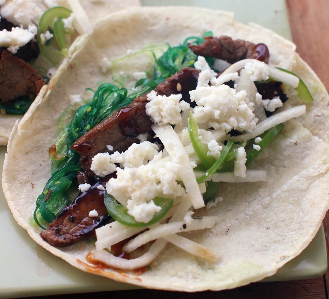 This July 27, 2015 photo shows beefy seaweed tacos with jalapeno jicama slaw in Concord, N.H. This dish is from a recipe by J.M. Hirsch. (AP Photo/Matthew Mead)