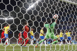 Brazil's Fernandinho, second right, scores an own goal past Brazil goalkeeper Alisson during the quarterfinal match between Brazil and Belgium at the 2018 soccer World Cup in the Kazan Arena, in Kazan, Russia, Friday, July 6, 2018. (AP Photo/Frank Augstein)