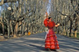 Seville, Spain. Model released photo of a Andalusian woman dress in the typical Sevillanas dress (Kike Calvo via AP Images)