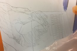 These sketched hands eventually will depict a child's fingers on a computer keyboard. (WTOP/Kristi King)