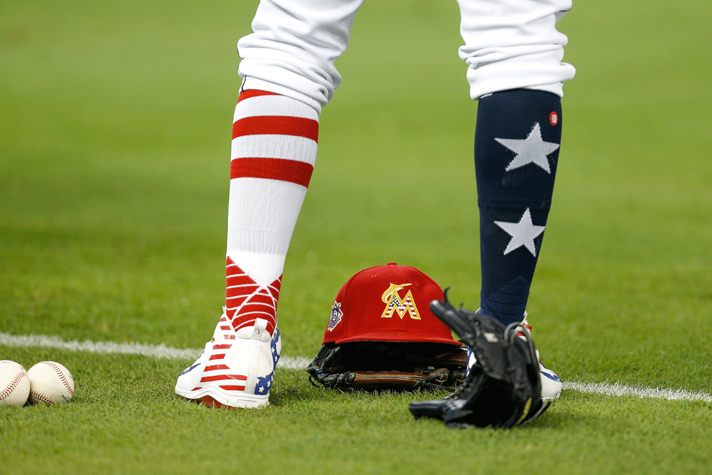 A detail of Miami Marlins second baseman Starlin Castro #13 Independence Day themed socks and hat prior to the game against the Tampa Bay Rays at Marlins Park on July 4, 2018 in Miami, Florida. (Photo by Michael Reaves/Getty Images)
