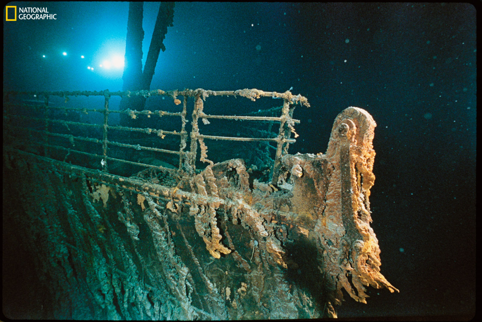 The bow railing of R.M.S. Titanic illuminated by the Mir 1 submersible behind the forward anchor crane. (Courtesy National Geographic/Emory Kristof)