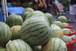 Watermelons are displayed for sale with summer fruits and vegetables at a farmers market in Falls Church, Va., Saturday, July 28, 2017. (AP Photo/J. Scott Applewhite)