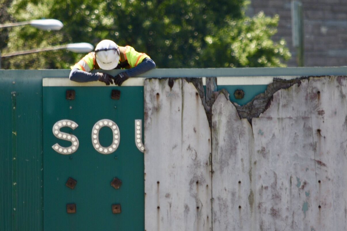 A worker bids a farewell to the South Leg of the Inner Loop Freeway. (WTOP/Dave Dildine)