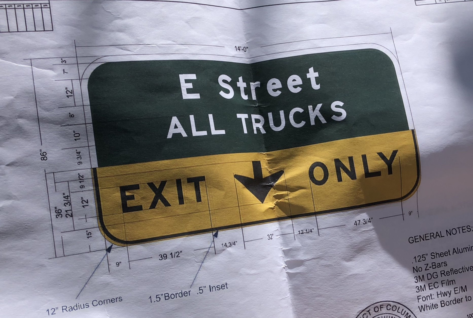 A diagram of the new overhead guide sign for the E Street Expressway. Since trucks are not allowed on I-66 inside the Beltway and commercial vehicles are not allowed on National Park Service roads, all trucks must.exit onto E Street NW. (WTOP/Dave Dildine)