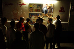 Patrons crowd a Mister Softee ice cream truck to buy ice cream as darkness envelops Weehaken, N.J. during a massive power outage Thursday Aug. 14, 2003. A massive power blackout hit U.S. and Canadian cities Thursday. (AP Photo/Jacqueline Larma)