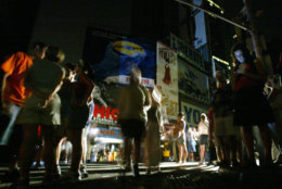 **FILE** In this Aug. 14, 2003 file photo, bystanders gather in Times Square in midtown Manhattan after a  blackout in New York. Five years after the nation's worst blackout, executives at some of the nation's largest power generators fear the U.S. could run short on electricity if it does not quickly spend more on infrastructure projects. (AP Photo/Joe Kohen, file)