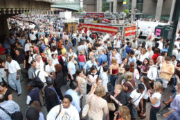 Bystanders gather outside Grand Central Station after a power black out in New York City, Thursday, Aug. 14, 2003.  The biggest power blackout in history hit steamy U.S. and Canadian cities Thursday, stranding people in subways, closing nuclear power plants in Ohio and New York state and choking streets with workers driven from stifling offices. (AP Photo/Mary Altaffer)