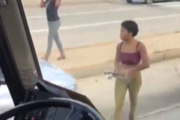 Dramatic video released by D.C. police shows a woman smashing the windows of a Greyhound bus with a car jack and attempting to run down the bus driver in Northeast D.C. Thursday. (Courtesy D.C. police)