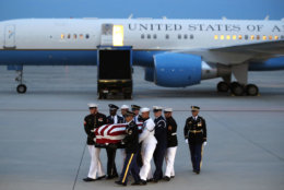 The flag-draped casket of Sen. John McCain, R-Ariz., is carried by an Armed Forces body bearer team to a hearse, Thursday, Aug. 30, 2018, at Andrews Air Force Base, Md. (AP Photo/Alex Brandon)