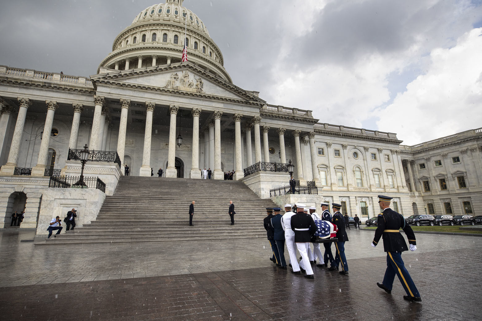 The flag-draped casket of Sen. John McCain, R-Ariz., is carried into the U.S. Capitol, Friday, Aug. 31, 2018, in Washington.  (Jim Lo Scalzo/Pool photo via AP)