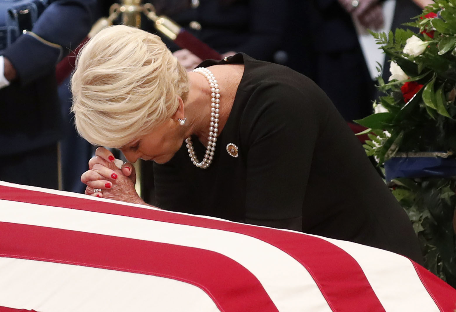 Cindy McCain pauses at the casket of her husband Sen. John McCain, R-Ariz., during a ceremony as McCain lies in state at the Rotunda of the U.S. Capitol in Washington, Friday, Aug. 31, 2018. (Kevin Lamarque/Pool Photo via AP)