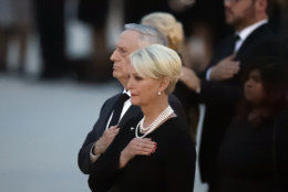 Defense Secretary Jim Mattis, left, stands with with Cindy McCain, the wife of Sen. John McCain, R-Ariz., as the casket of McCain is placed into a hearse on the tarmac, Thursday, Aug. 30, 2018, at Andrews Air Force Base, Md. (AP Photo/Alex Brandon)