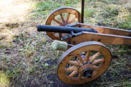 Old guns on wheels in 1812. Artillery fortress guns on wheels.