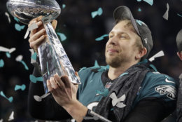 Philadelphia Eagles' Nick Foles holds up the Vince Lombardi Trophy after the NFL Super Bowl 52 football game against the New England Patriots, Sunday, Feb. 4, 2018, in Minneapolis. The Eagles won 41-33. (AP Photo/Matt Slocum)