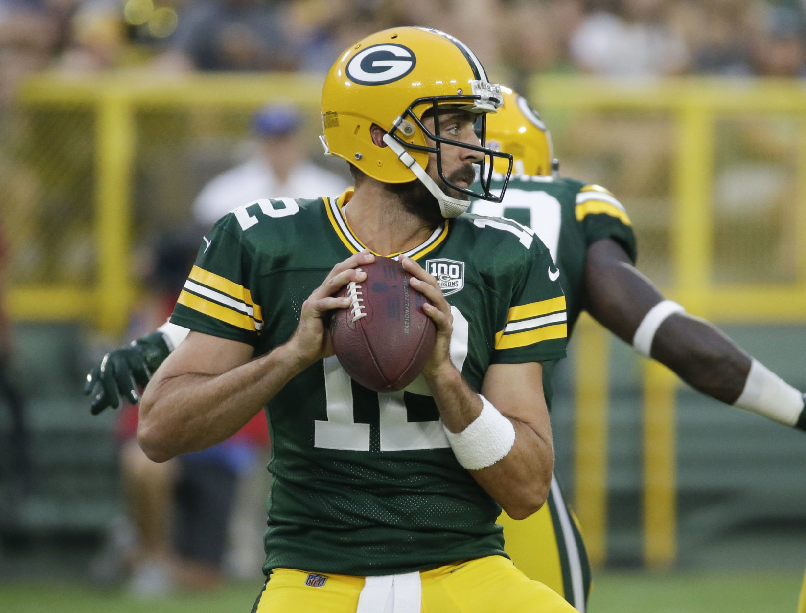 Green Bay Packers' Aaron Rodgers throws during the first half of a preseason NFL football game against the Pittsburgh Steelers Thursday, Aug. 16, 2018, in Green Bay, Wis. (AP Photo/Mike Roemer)