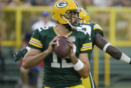 Green Bay Packers' Aaron Rodgers throws during the first half of a preseason NFL football game against the Pittsburgh Steelers Thursday, Aug. 16, 2018, in Green Bay, Wis. (AP Photo/Mike Roemer)
