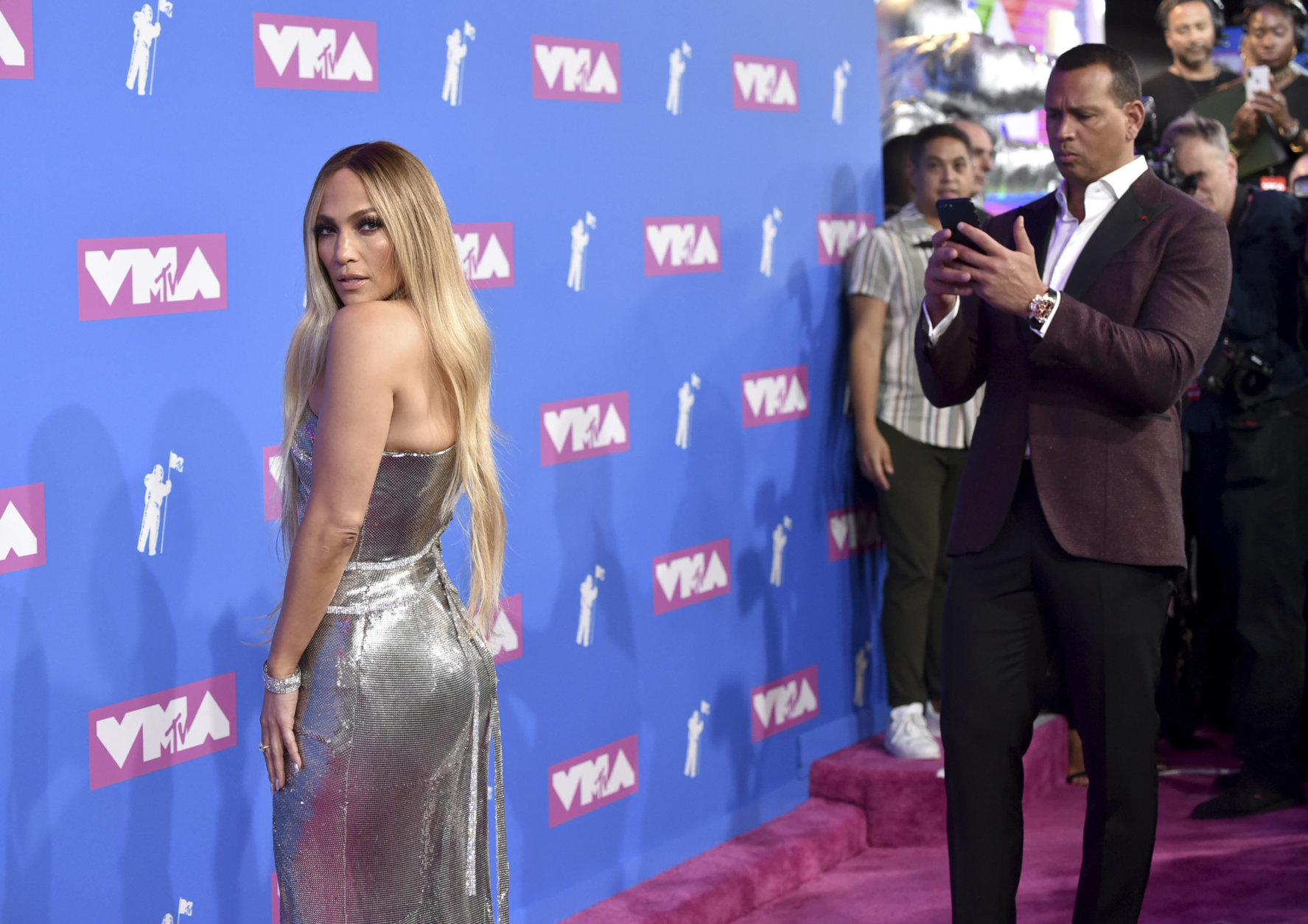 Alex Rodriguez, right, photographs Jennifer Lopez as they arrive at the MTV Video Music Awards at Radio City Music Hall on Monday, Aug. 20, 2018, in New York. (Photo by Evan Agostini/Invision/AP)