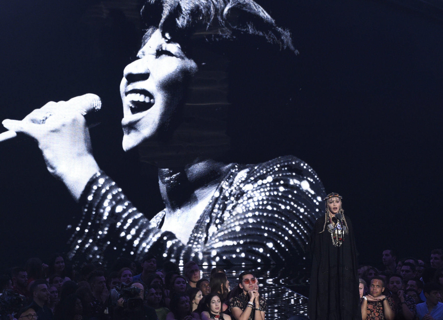 Madonna presents a tribute to Aretha Franklin, pictured on screen, at the MTV Video Music Awards at Radio City Music Hall on Monday, Aug. 20, 2018, in New York. (Photo by Chris Pizzello/Invision/AP)